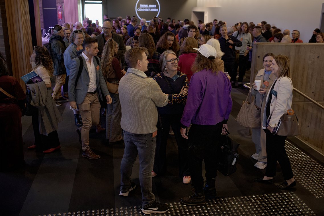 Crowd of people at a networking event or conference.